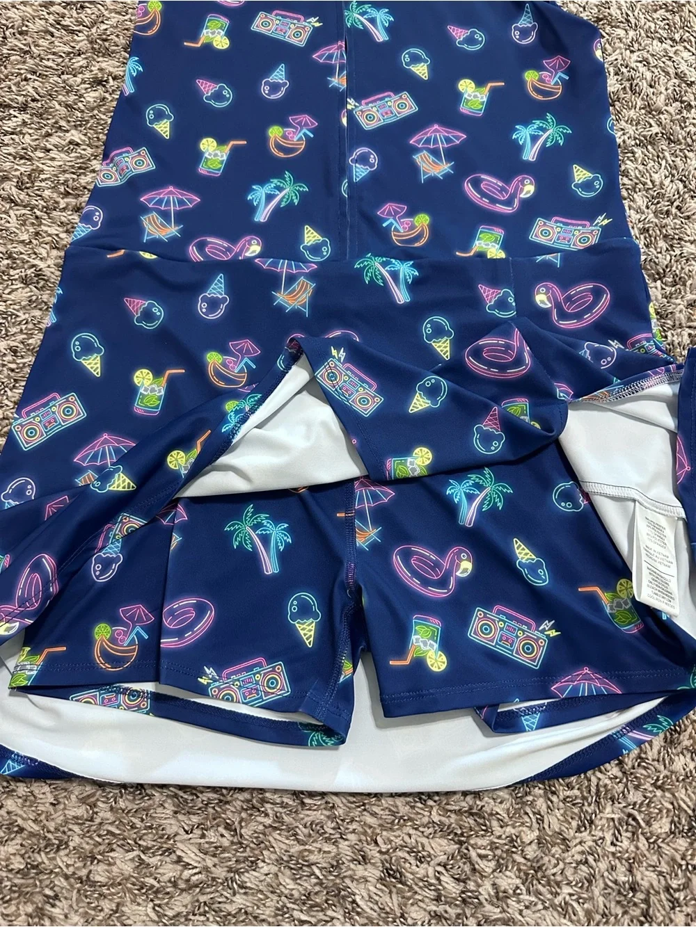Birdie bound Girls' Navy Neon Print Sleeveless Polo romper